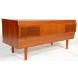 A retro mid century teak wood sideboard stereogram cabinet sideboard. Raised on tapering legs with