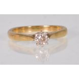 A hallmarked 18ct gold and diamond solitaire ring  illusion set with a round cut diamond. Hallmarked