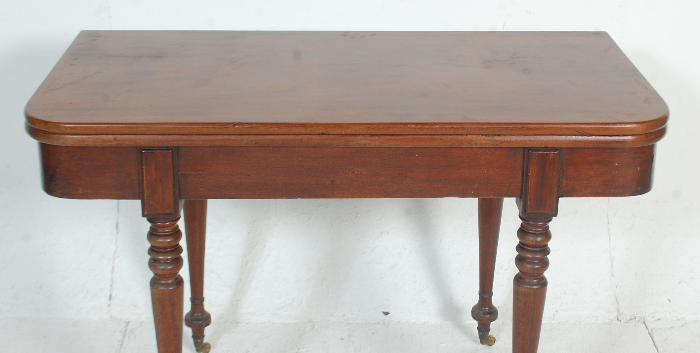 A 19th Century mahogany card / tea table having a folding and revolving top with brass fittings - Image 2 of 7