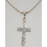 A good 19th Century Victorian silver cross pendant on a silver chain having a spring ring clasp.