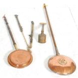 Two good 19th Century Victorian copper bed pans together with three brass sprayers with some bearing