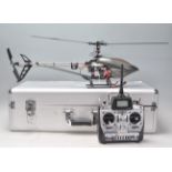 A contemporary remote control toy helicopter having a fibreglass body having an E fly ETC61 remote