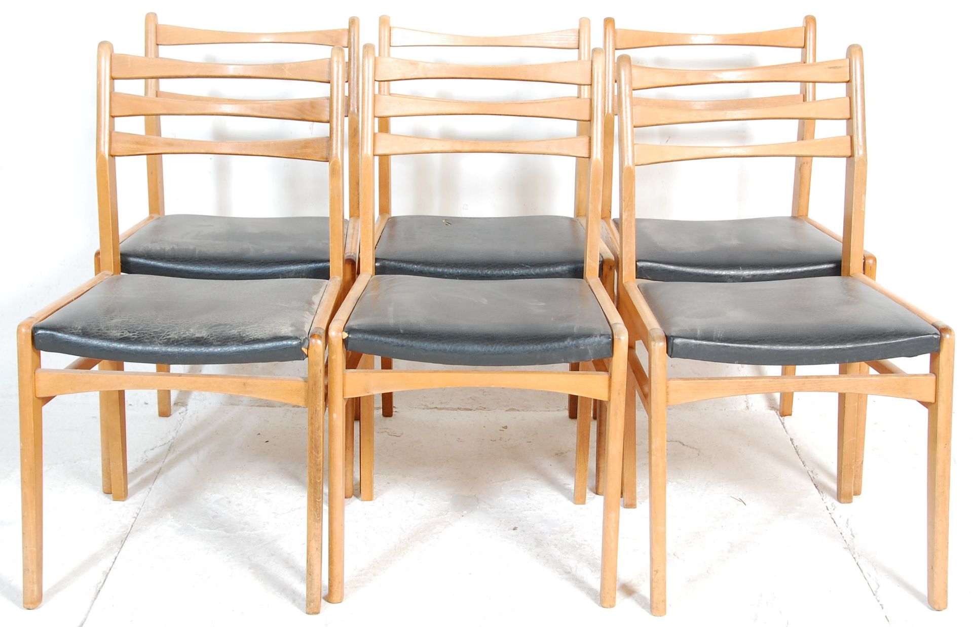 A set of six vintage retro mid 20th Century dining chairs being wooden framed with three