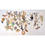 A collection of vintage 20th Century brooches to include a group of 19th Century mother of pearl
