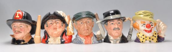 A group of five Royal Doulton character jugs to include The Fireman D6697, Town Crier D6895,