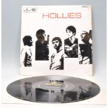 A vinyl long play LP record album by Hollies – The Hollies – Original black and yellow 1st U.K.