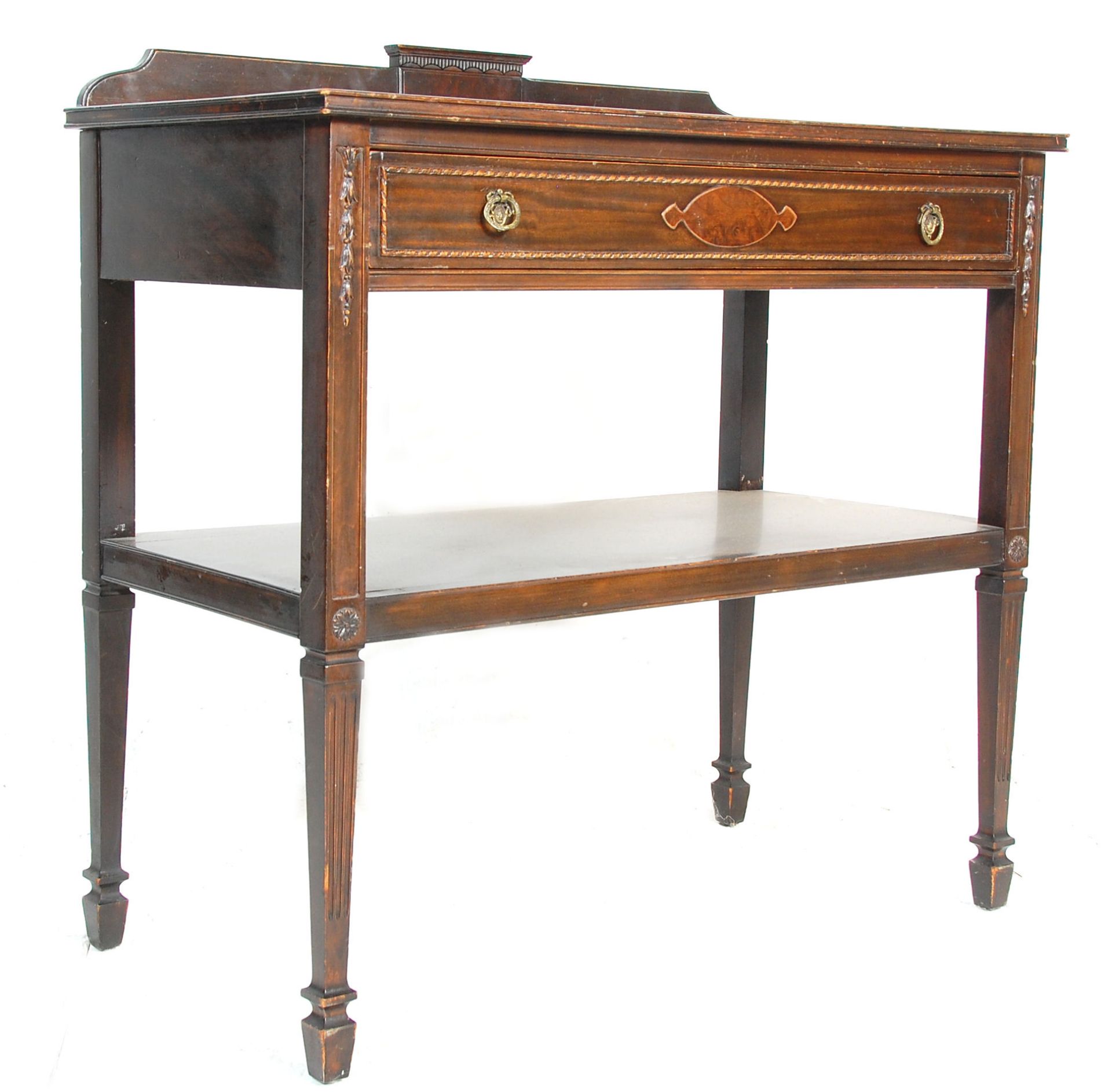 An early 20th Century Edwardian mahogany serving table having a gallery back, with a single drawer