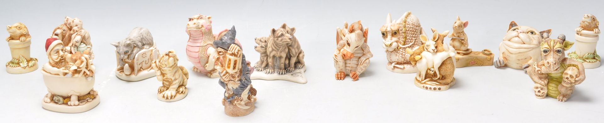 A group of fourteen Harmony Kingdom resin animal novelty figurines to include dragons, a kangaroo