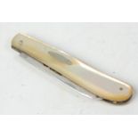 An early 20th Century mother of pearl handled fruit knife having a silver hallmarked blade.