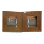 A pair of vintage 20th Century wall mirrors having wide copper frames. H40 W40cm