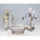 Two 20th Century silver plated table centerpiece epergnes to include one of tripod form with three