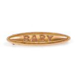 An early 20th Century 9ct yellow gold baby brooch. Total weight 1.0g. Measures 1.5 inches wide.