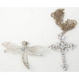 A stamped sterling silver dragonfly brooch with articulated wings together with a stamped silver