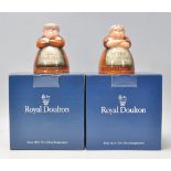 A pair of Royal Doulton salt and pepper pots entitled 'Votes for Women' and 'Toil for Men', D7066