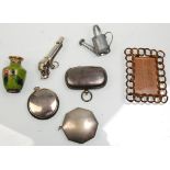 A mixed group of vintage curious to include a miniature iron work frame, a silver plate whistle in