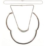 A group of three ladies silver necklaces to include a three panel collar necklace bearing London