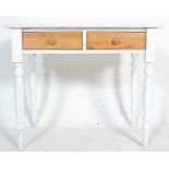 A 19th Century Victorian shabby chic painted pine writing table desk raised on turned legs with twin