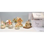 A mixed group of mostly ceramic figures to include 3x Beatrix Potter Musical figures, teapot with