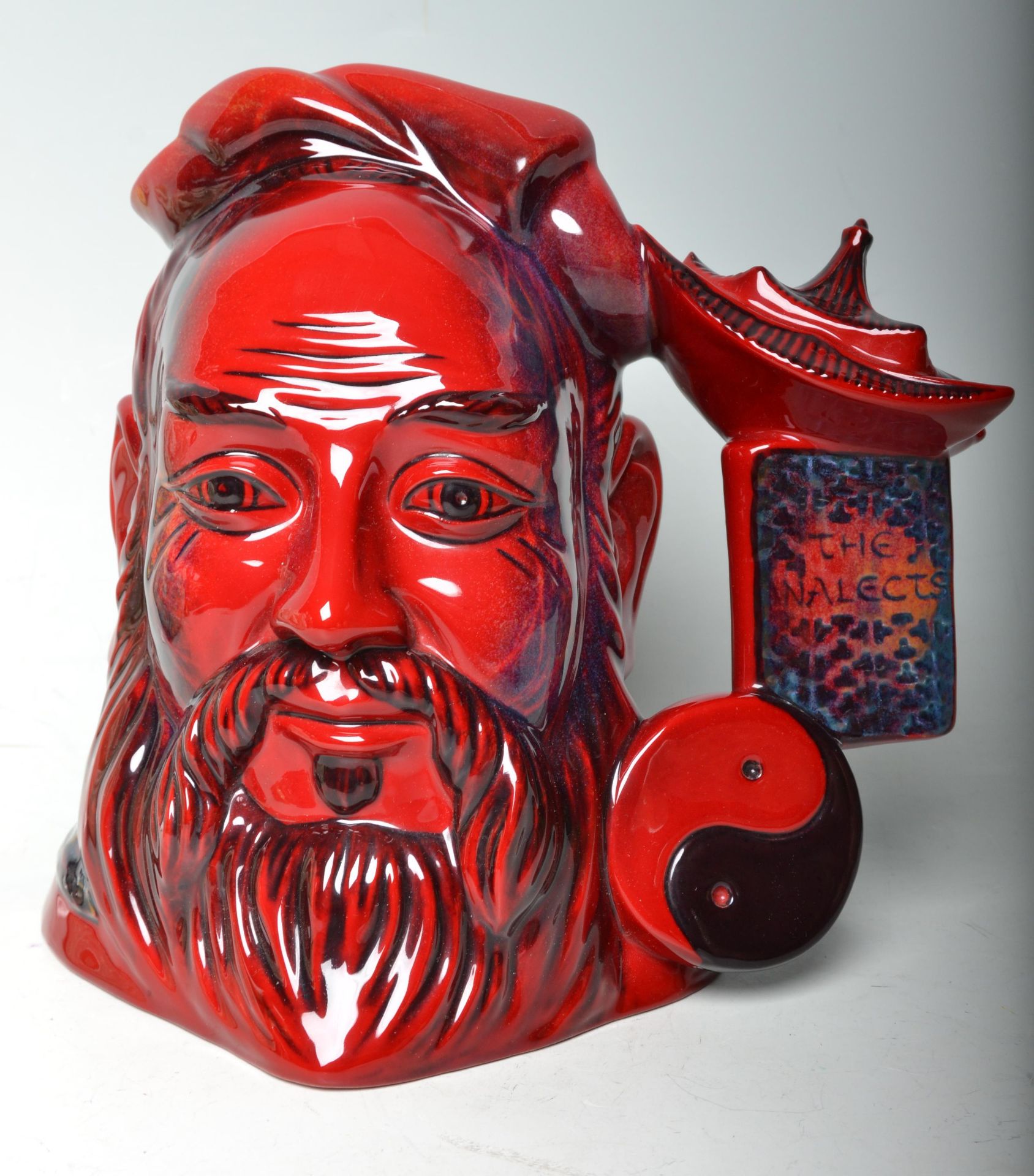 Flambe - A Royal Doulton ceramic Character / Toby jug Confucius D7003 in the Flambe pattern. Marks