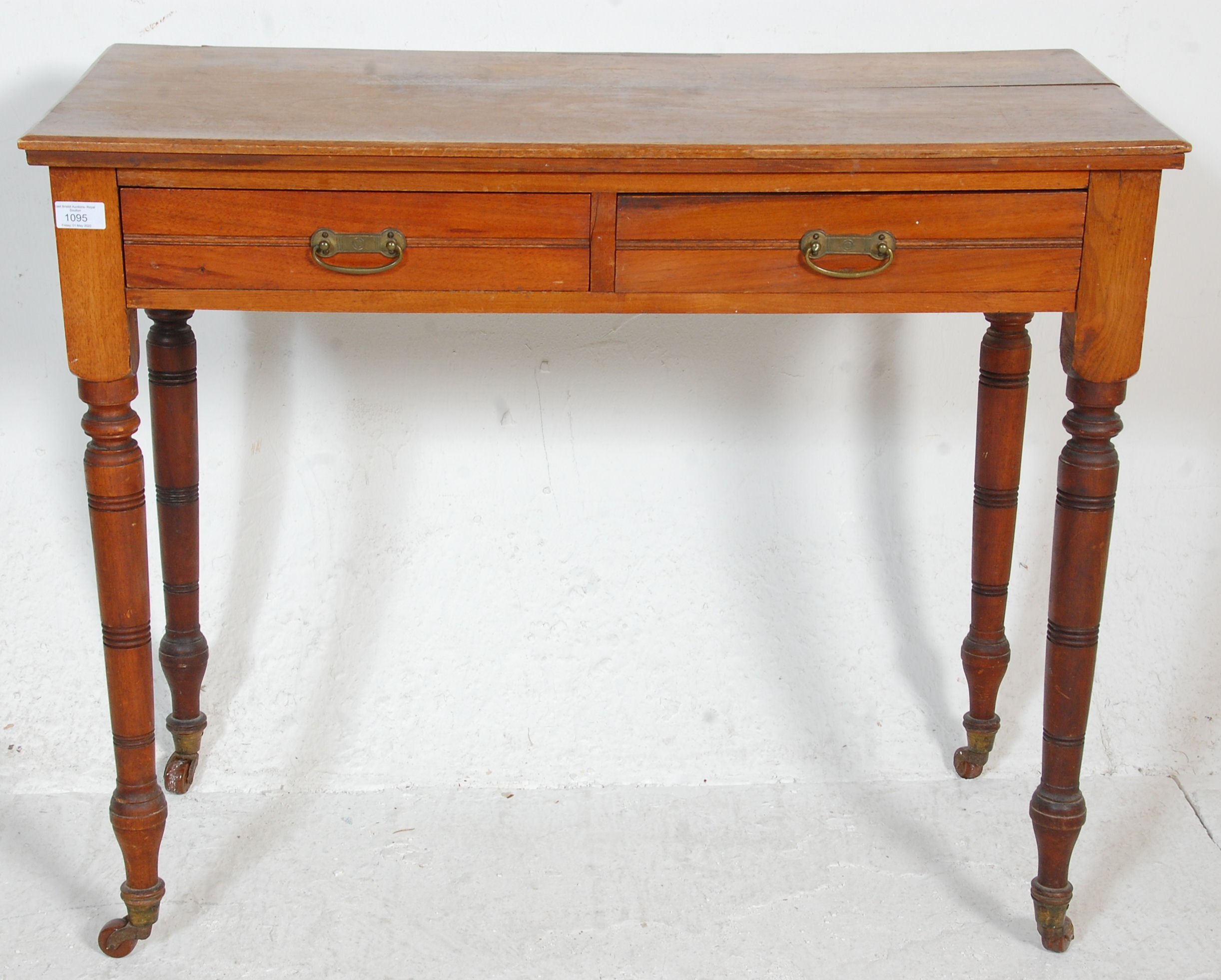 A late Victorian ash / oak writing table desk being raised on turned legs with castors having frieze - Image 2 of 6