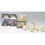 A collection of Disney figurines to include Snow White; Grumpy's Bathtime, a beauty and the Beast
