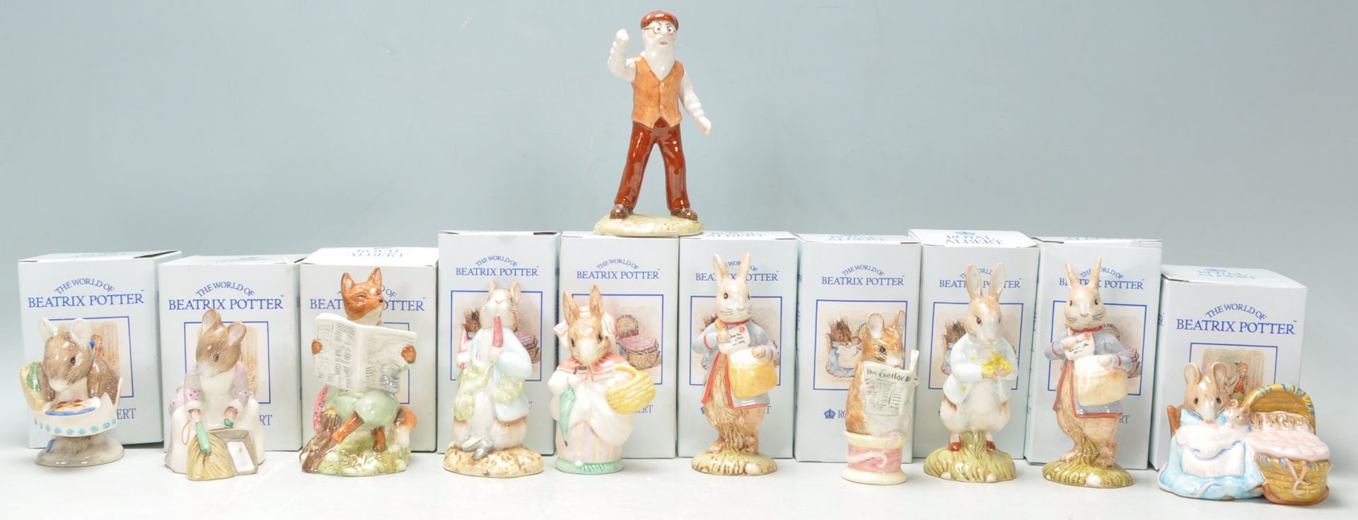 A collection of eleven Royal Albert ceramic figures in 'The World Of Beatrix Potter Collection' to