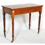 A late Victorian ash / oak writing table desk being raised on turned legs with castors having frieze