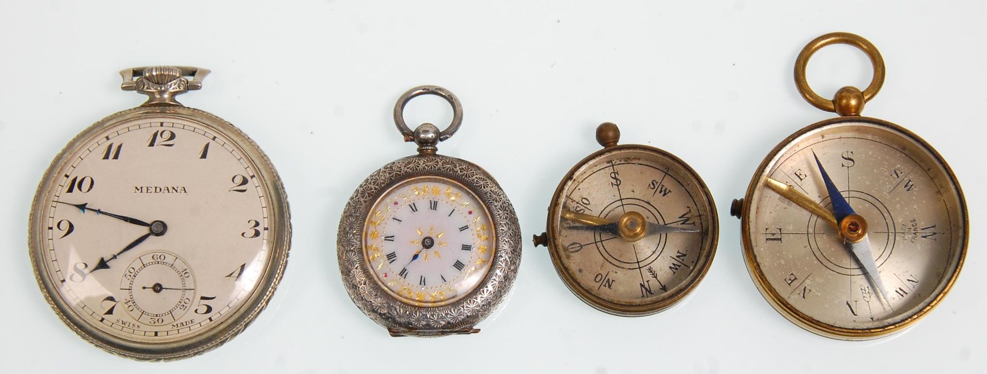 An early 20th Century silver pocket fob watch having a white enamelled face with roman numeral