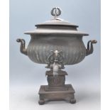 A 19th Century Victorian samovar having a reeded body with twin turned bone handles, raised on a