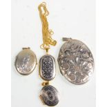 A group of four silver lockets to include two gilt examples having silver and black painted