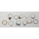 A collection of eleven silver ladies dress rings to include a red stone cabochon ring, a ring set