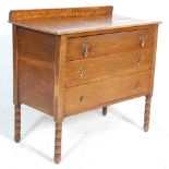 An early 20th Century 1930's oak chest of drawers, having a gallery back with three drawers with