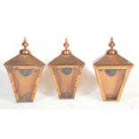 A group of three Victorian style street lantern light fittings constructed from copper with