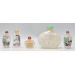 A group of five Oriental Chinese glass painted perfume scent bottles of varying form and decoration.