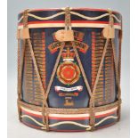 A 20th Century vintage military related ice bucket in the form of a drum having a black