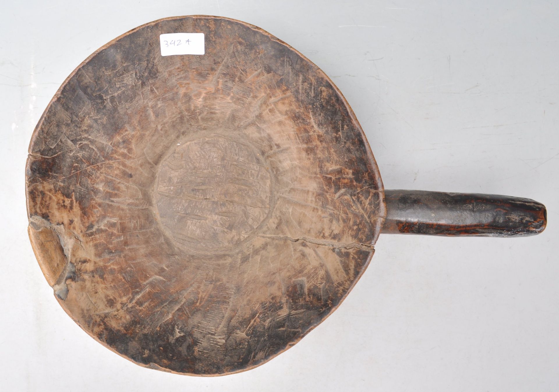 A antique African carved hardwood tribal bowl of conical form having a large carved handle to one - Bild 5 aus 6