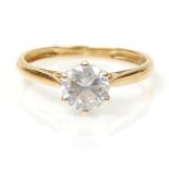 A hallmarked 18ct gold solitaire ring set with a round cut white stone. Hallmarked Birmingham 2008.