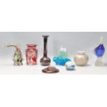 A collection of 20th Century vintage retro glass to include a Mdina vase with a bulbous body and