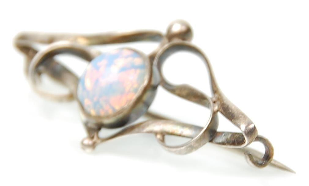 An early 20th Century Art Nouveau silver brooch set with a central opal panel within an openwork - Image 2 of 4