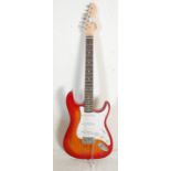 A vintage Irin electric Fender strat style guitar having a cherry burst body with a white scratch