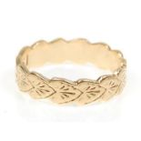 A good 9ct yellow gold, English hallmarked band ring having engraved heart decoration. Makers mark