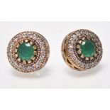 A pair of ladies dress stud earrings of Renaissance style set with round cut green stones and CZ'