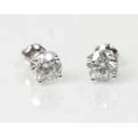 A pair of platinum and diamond stud earrings set with brilliant cut diamonds. Studs marked 950