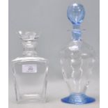 Two vintage 20th Century glass decanters to include a blue glass bottle decanter with a bulbous form
