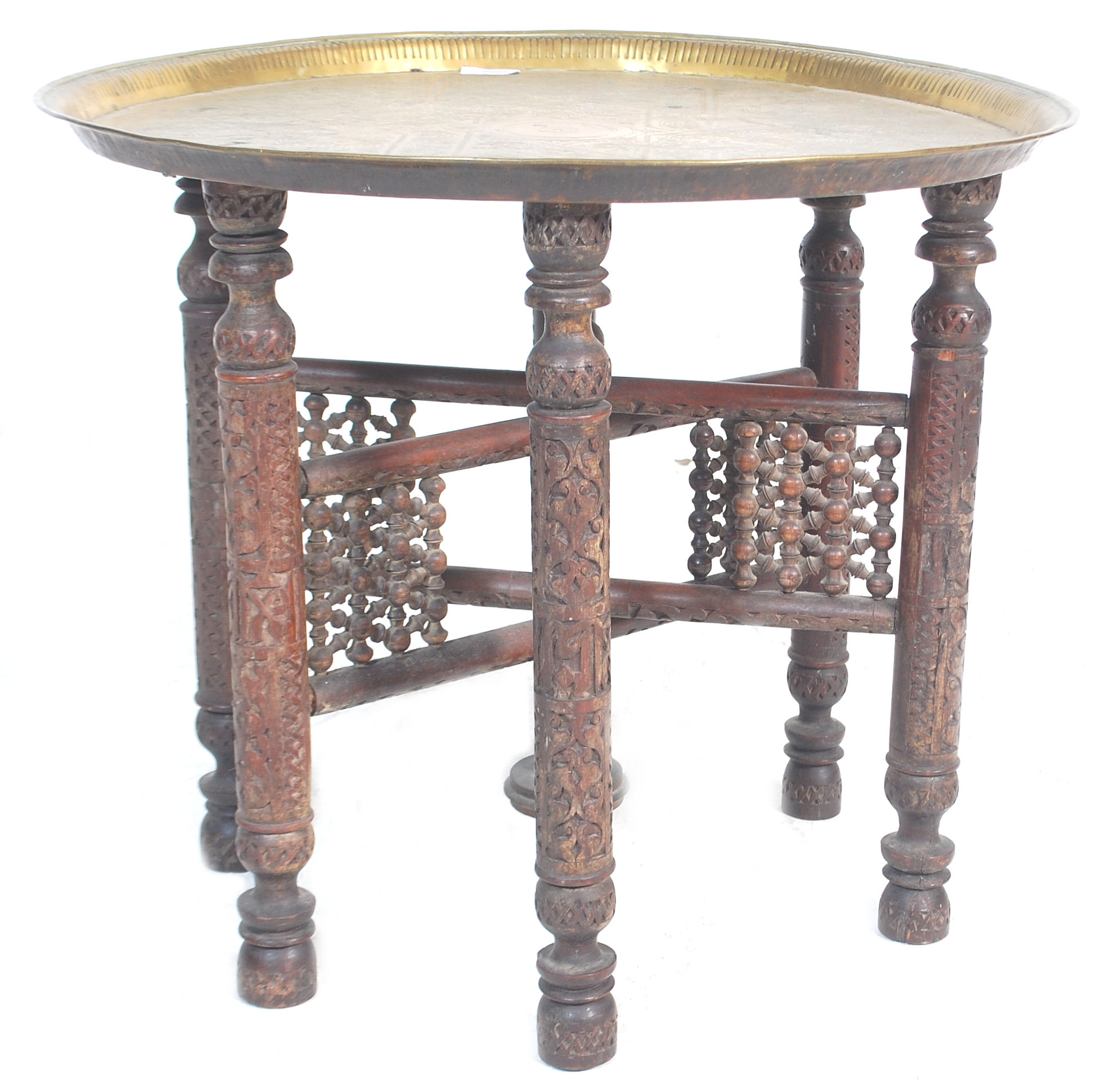 A 20th century brass top Moorish / Binares traders table having a brass chase decorated top with