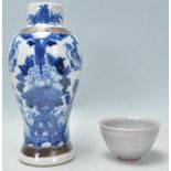 A 19th Century Chinese crackle glaze blue and white baluster vase having hand painted peony