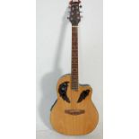 A 20th Century gear4music electric acoustic six string guitar having a domed back with dark wood