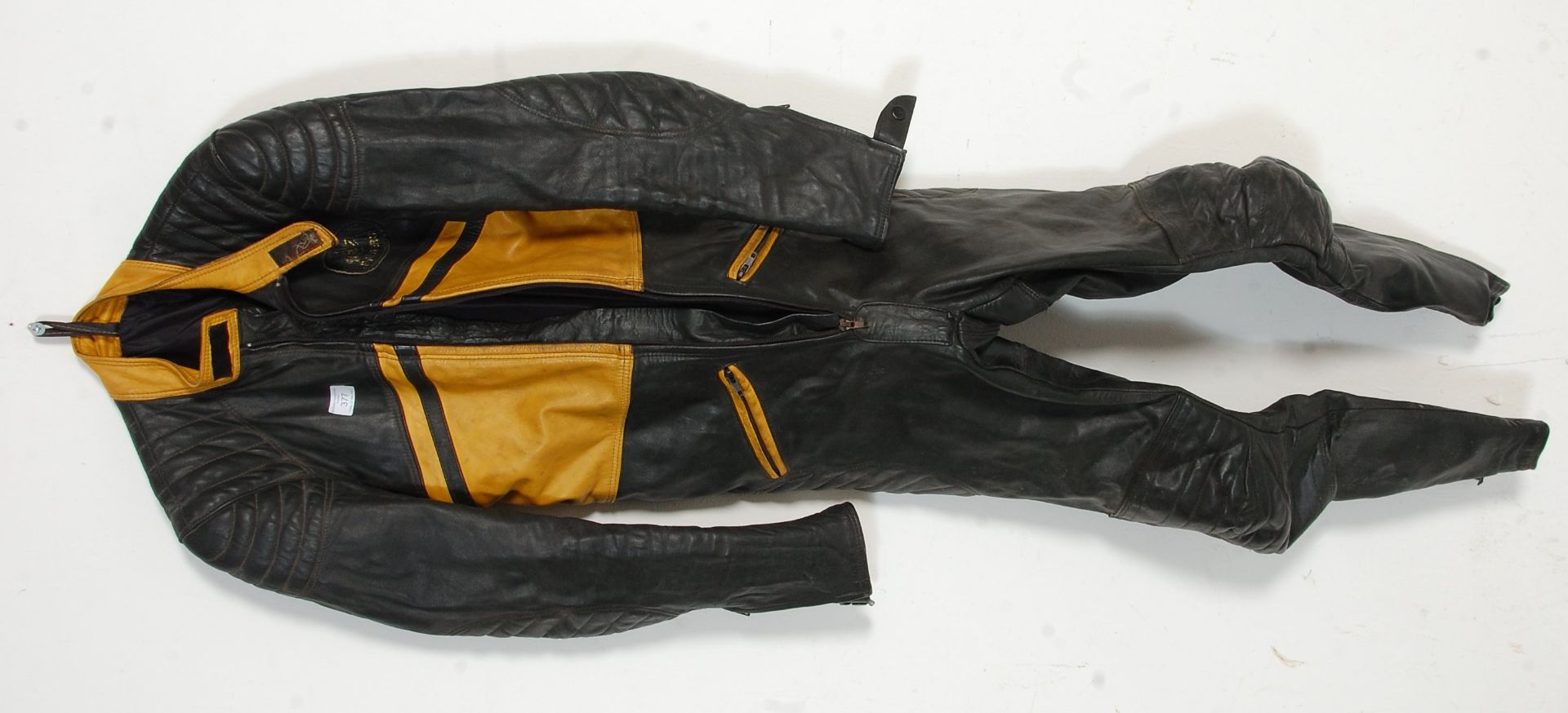 A set of vintage Kett bikers / motorbike leathers, having a zip fasting with yellow panel detailing,