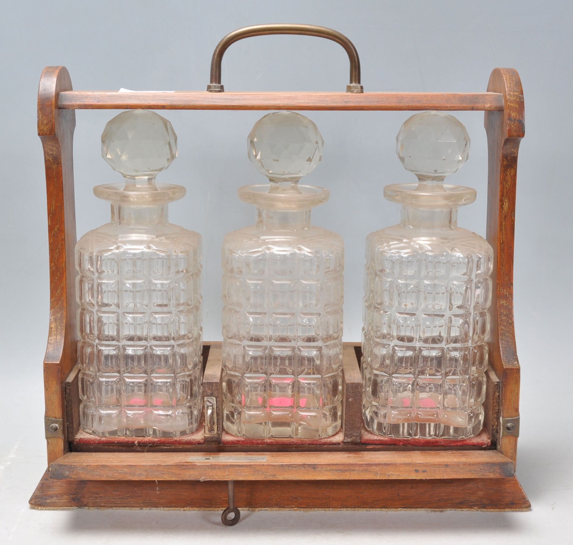 A 20th Century wooden drinks tantalus cabinet holding three cut glass decanters complete with - Bild 2 aus 5