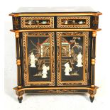 A 20th Century Chinese sideboard cupboard having two drawers above twin door cupboards, having